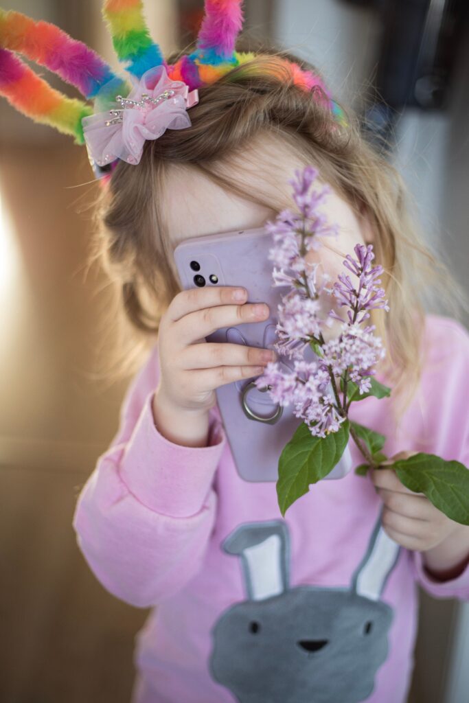 child holding smartphone
