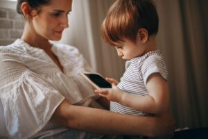 child holding smartphone