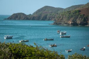 island coastline fishing boats